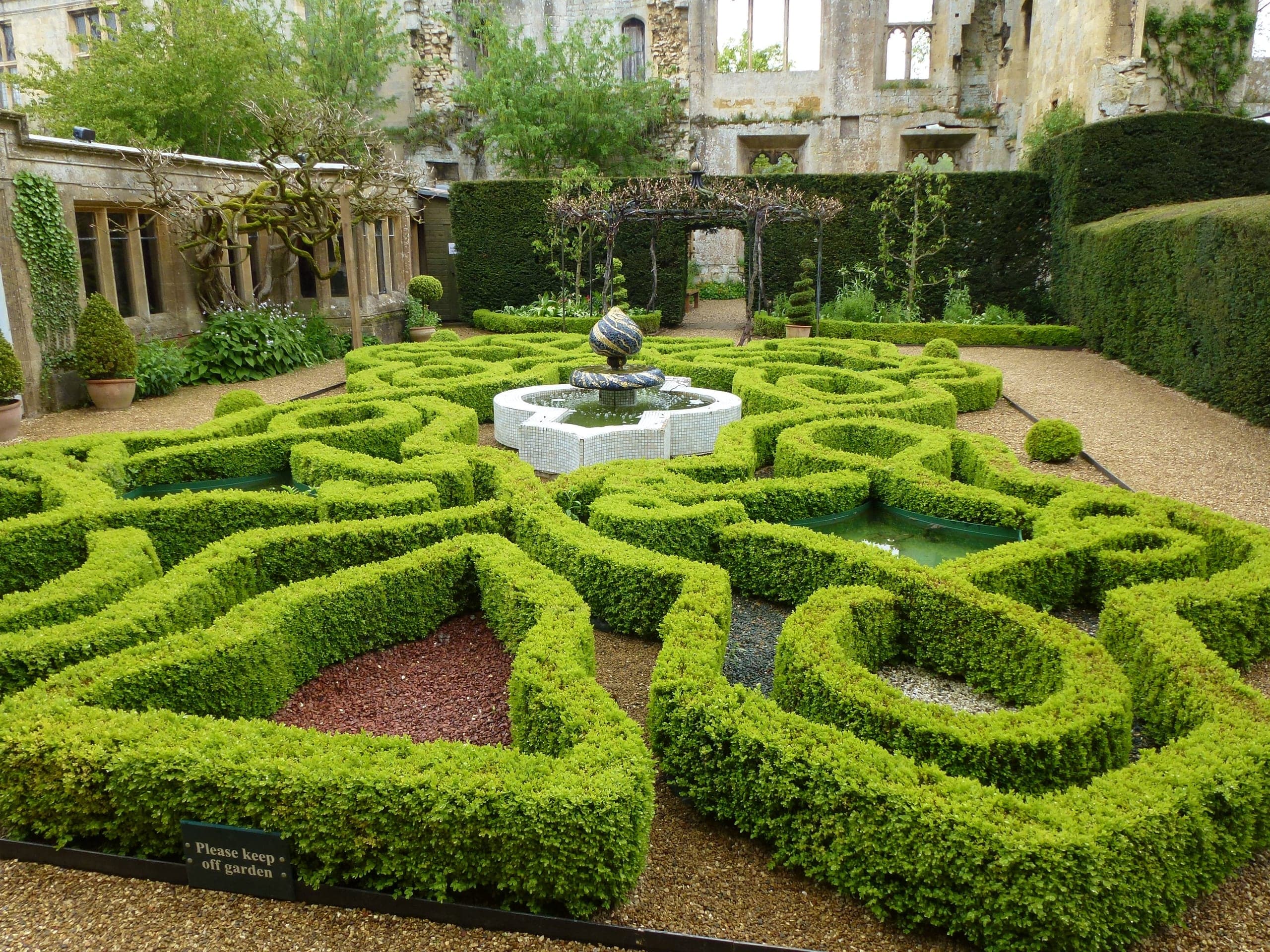 Formal topiary garden at Sudeley Castle in the Cotswolds