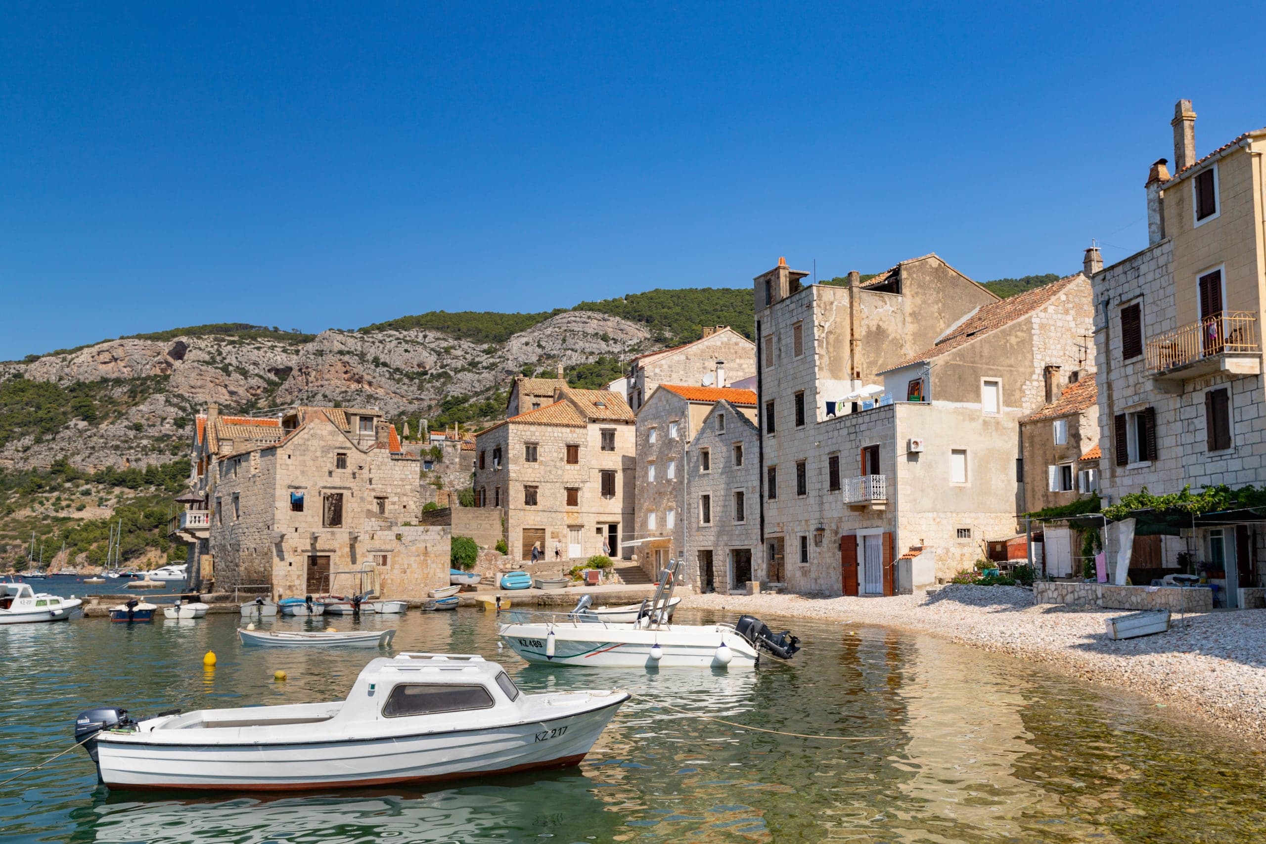 Boats and stone waterfront in Komiza on Vis