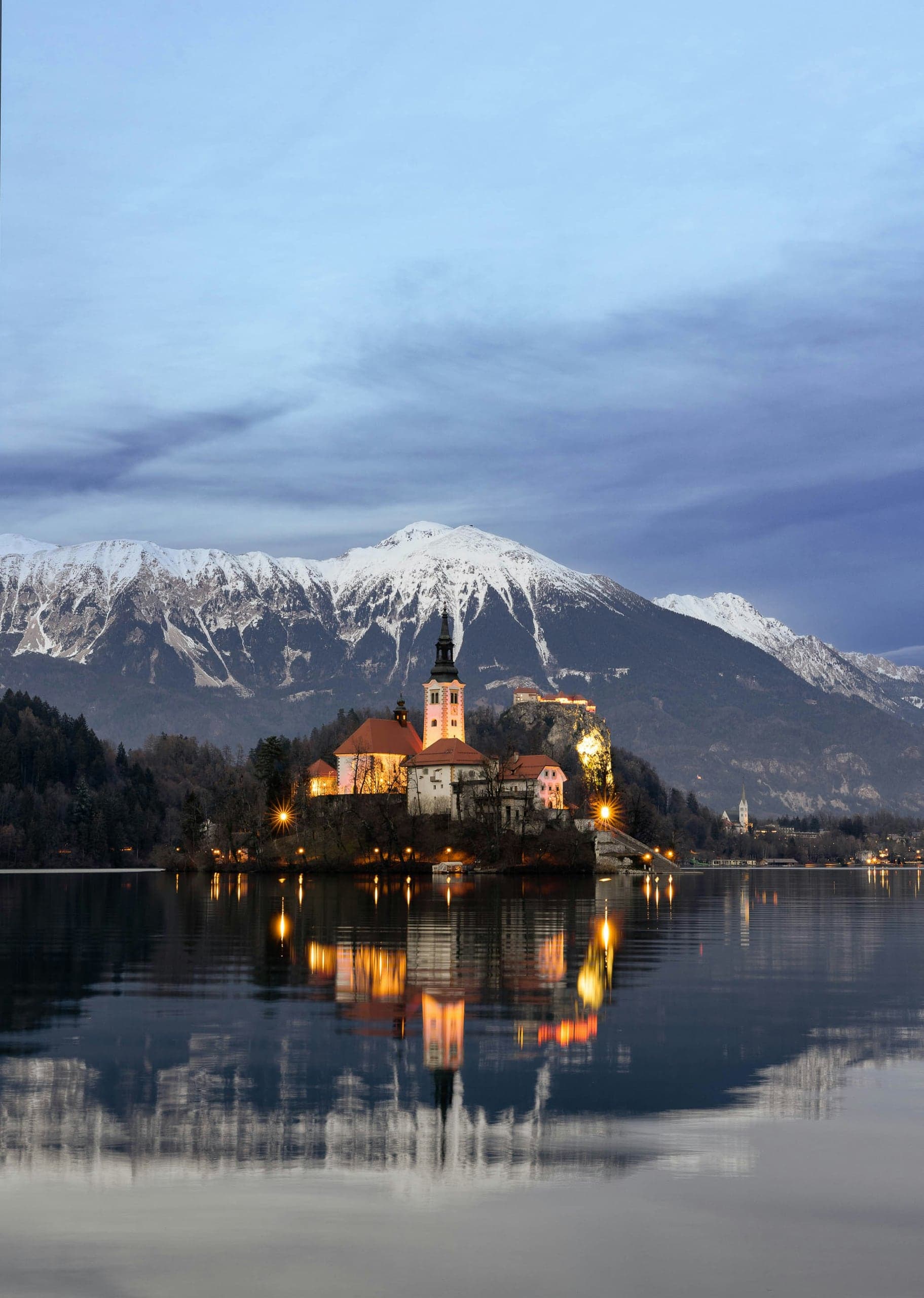 Bled Island church illuminated in winter blue hour