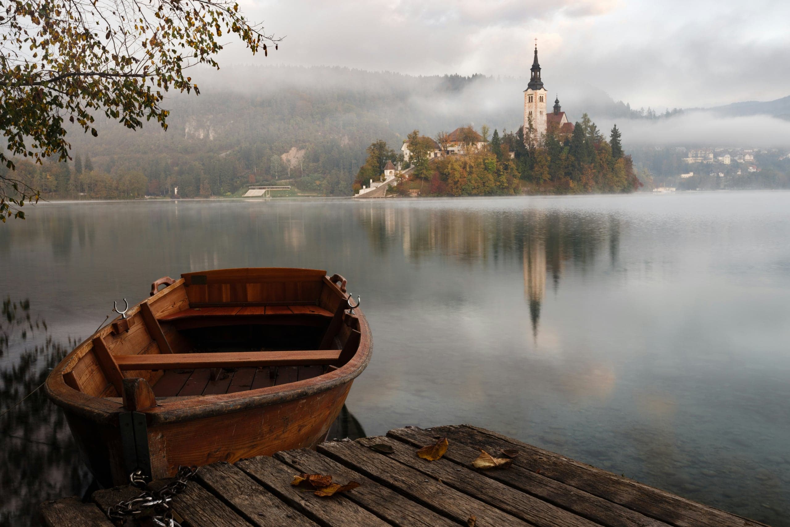 Traditional wooden boat on Lake Bled in early morning