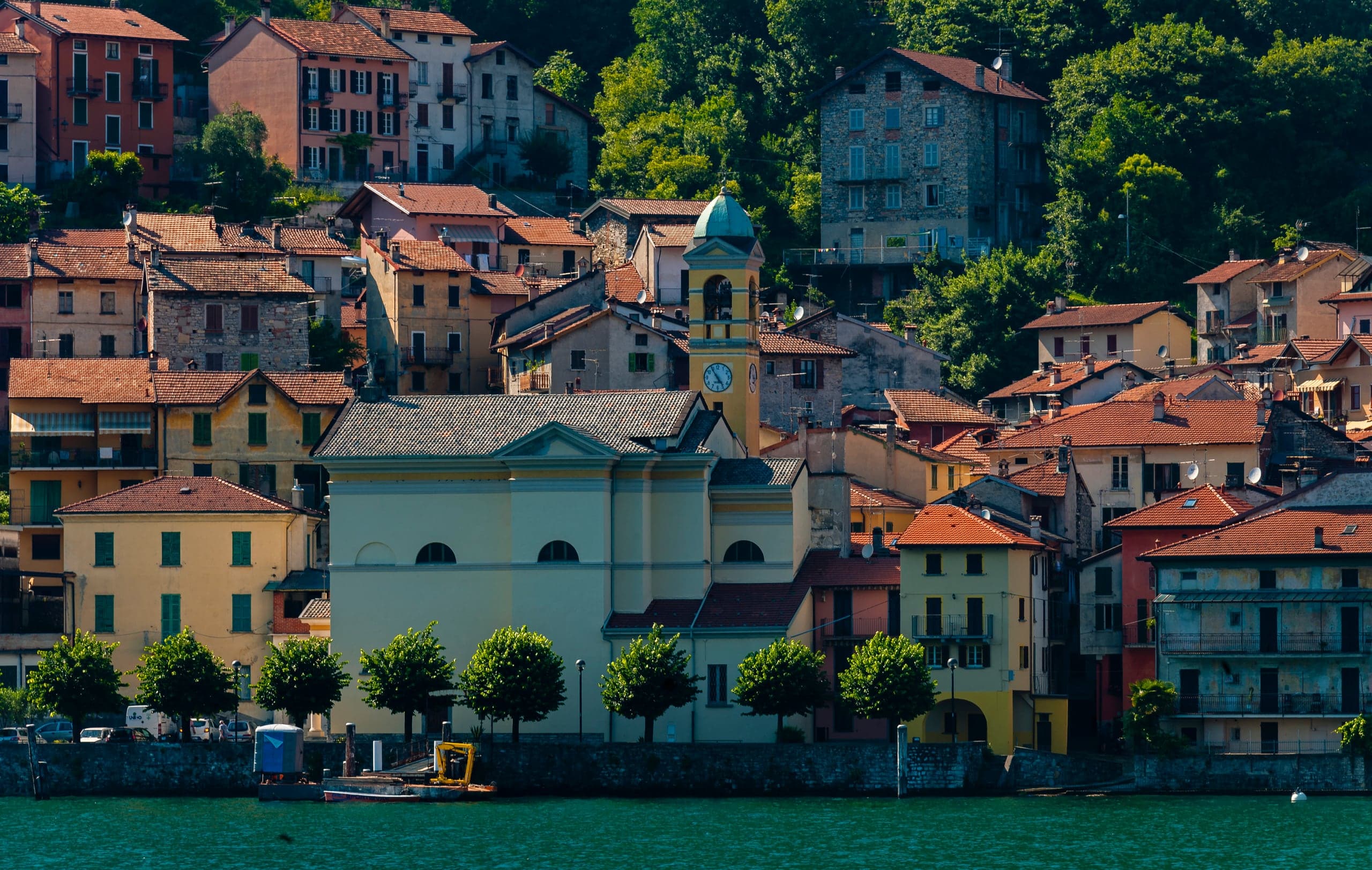 Stone waterfront of Colonno viewed from a Lake Como ferry