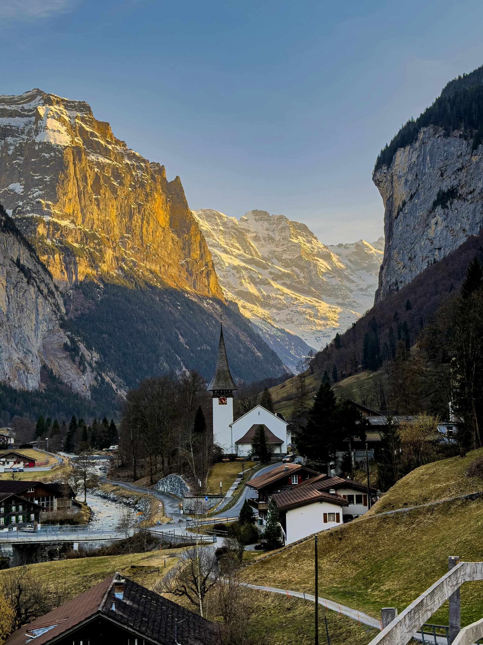 A quaint swiss village nestled in a mountain valley.