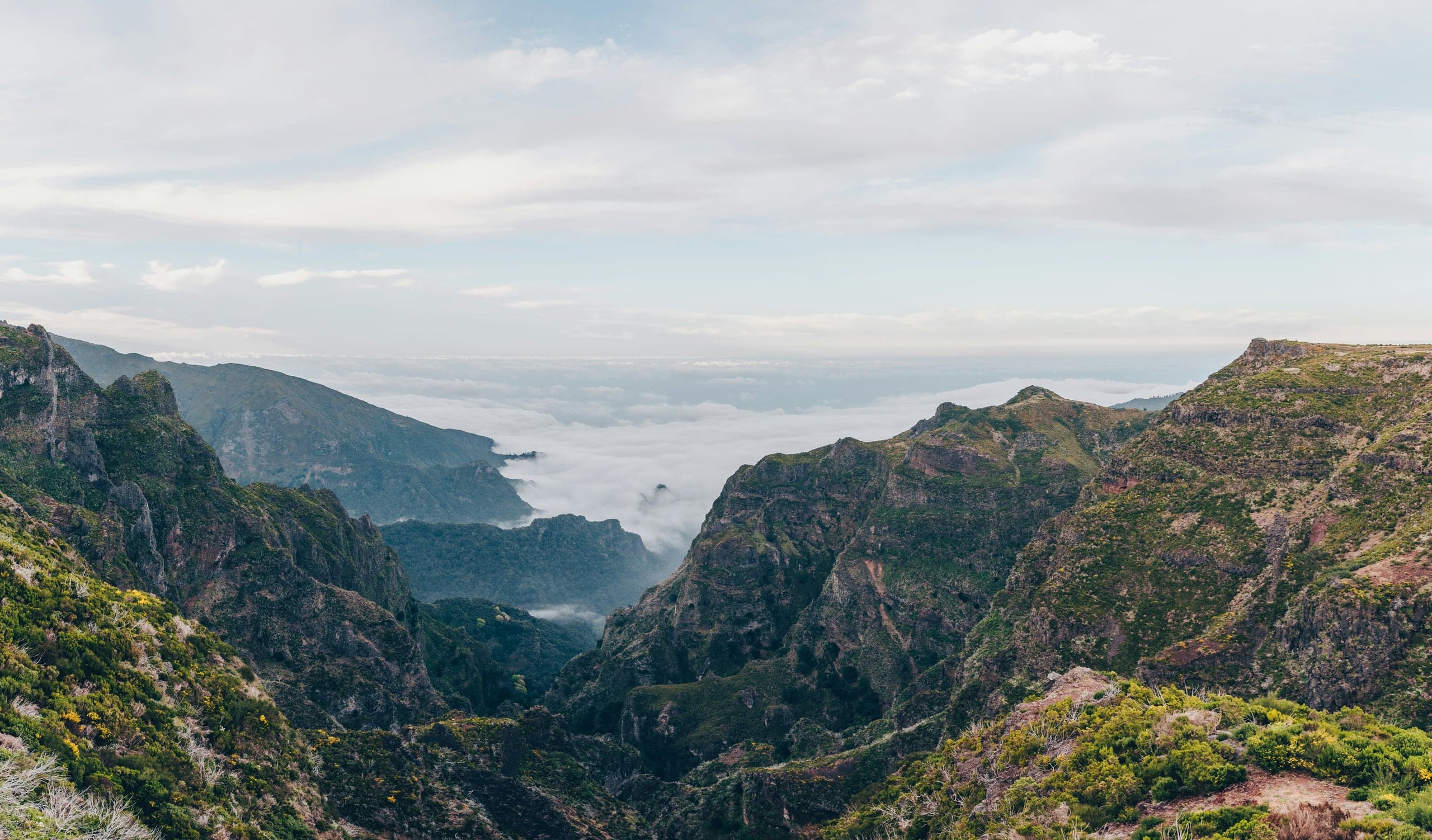 The high mountain road toward Pico do Arieiro above a sea of clouds