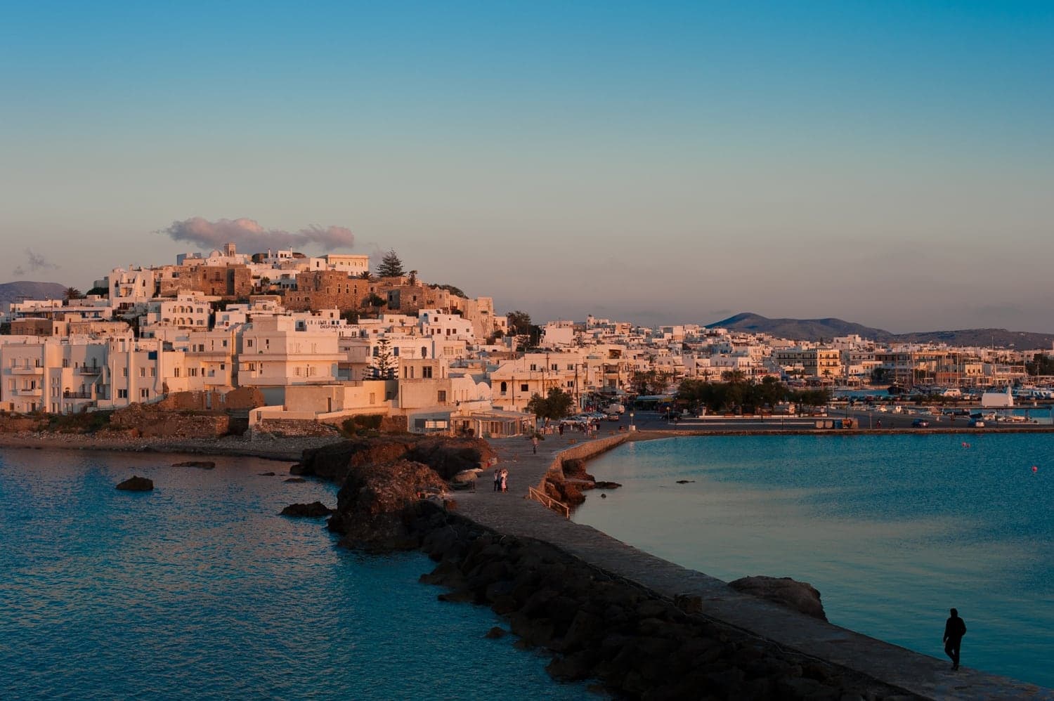 Naxos Chora glowing across the harbor at sunset