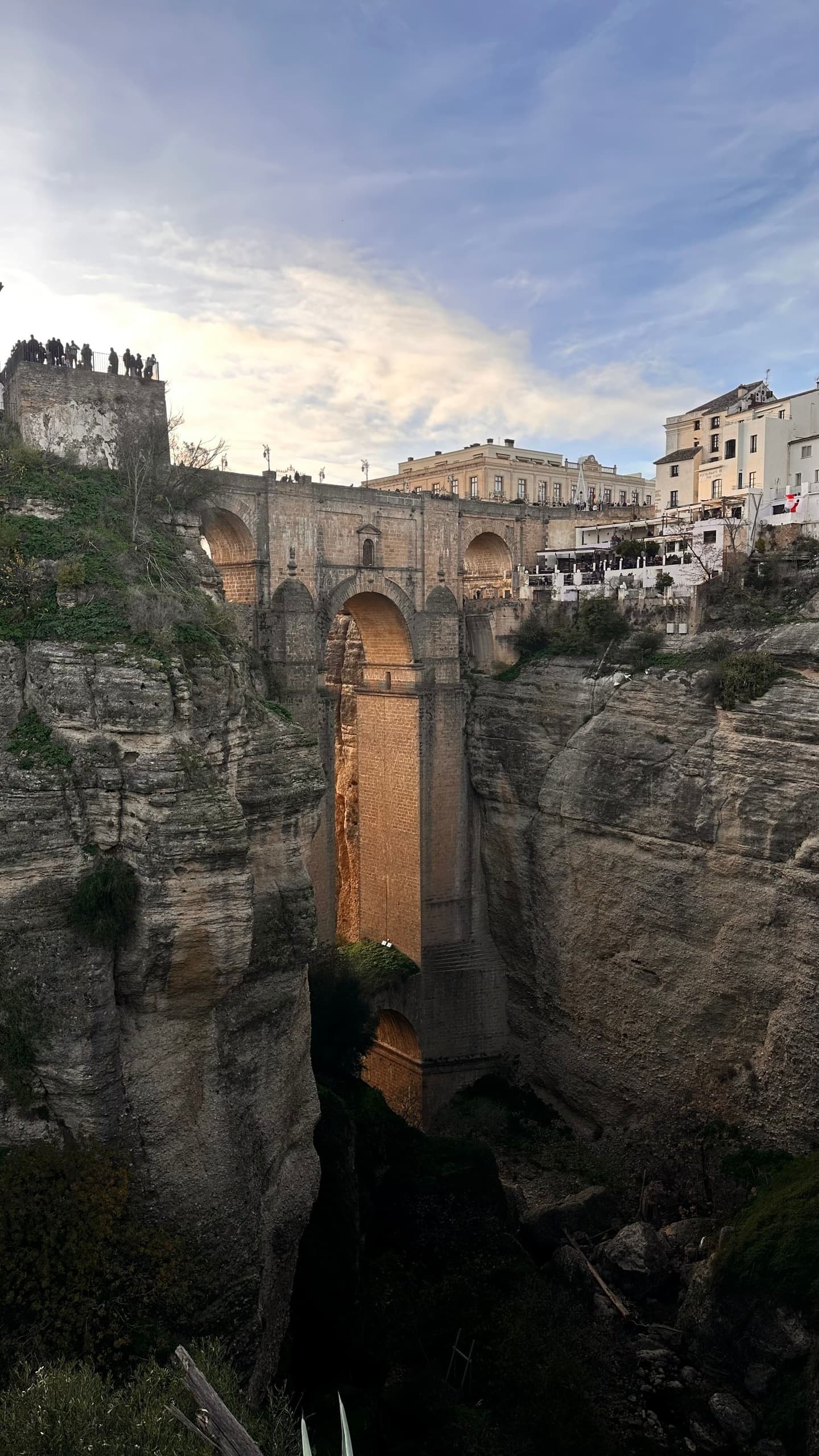 Warm sunset light across Puente Nuevo and the cliffs of Ronda