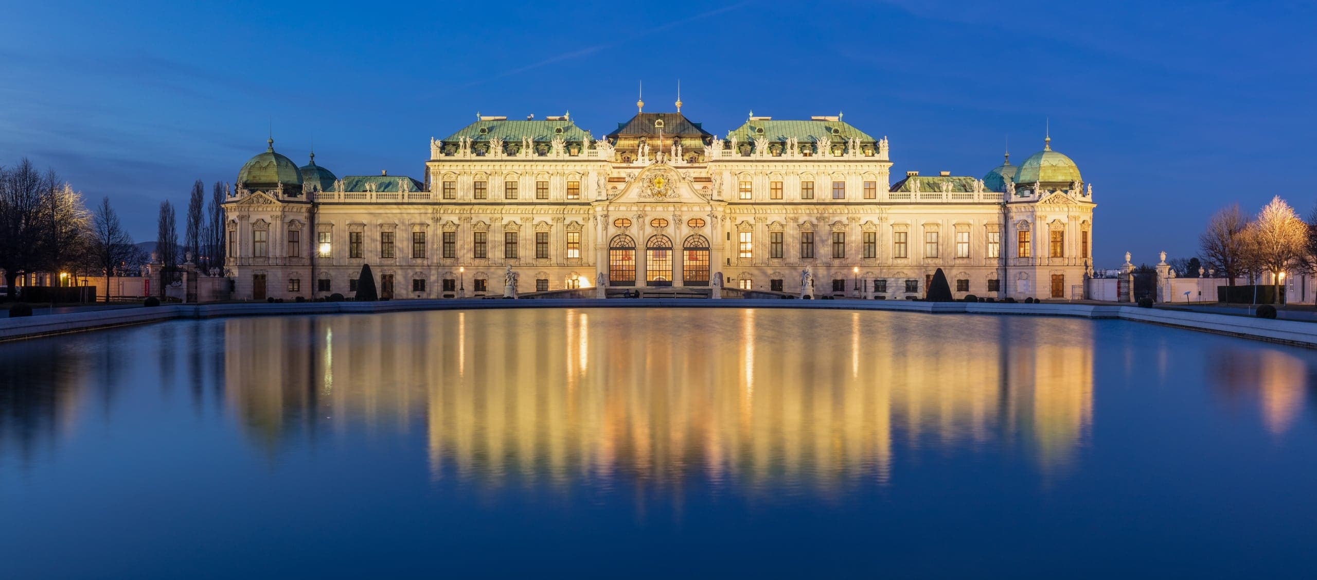 Upper Belvedere palace reflected in its pool at blue hour