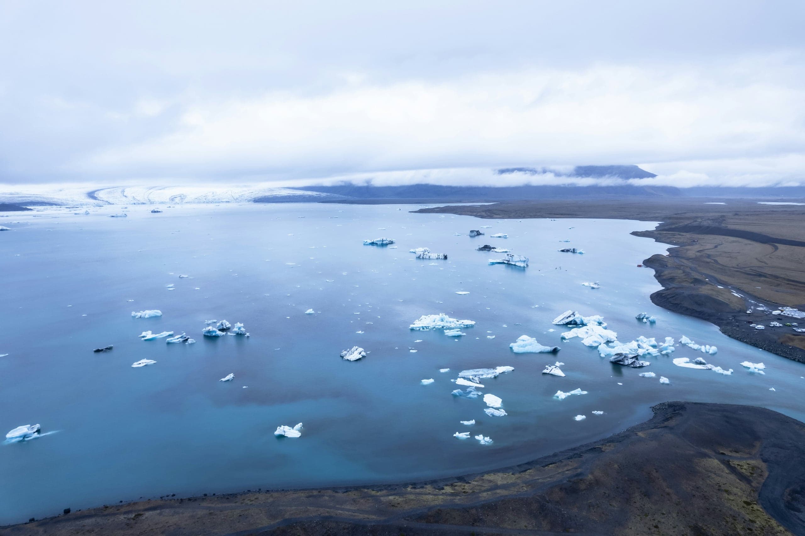 Icebergs scattered across Jökulsárlón Glacier Lagoon beneath Breiðamerkurjökull