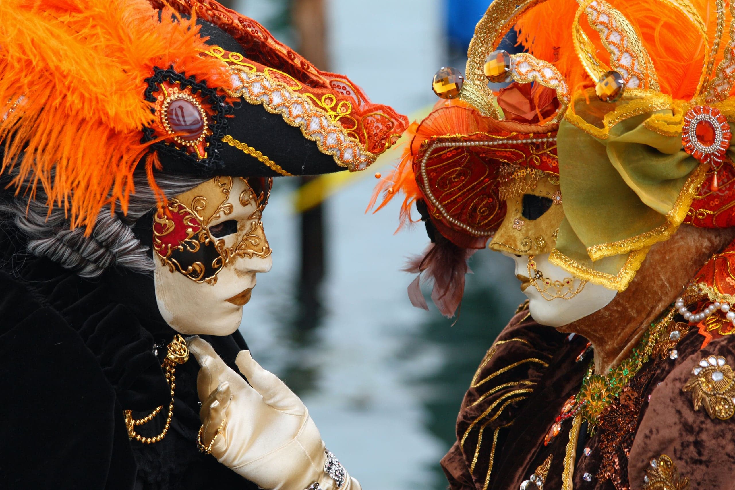 Two elaborately masked figures at Venice Carnival